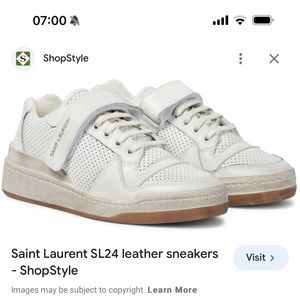 St. Laurent white leather sneakers.